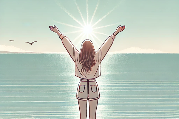 【映画でSEL】海辺の朝日に向かって手を広げる女性の後ろ姿